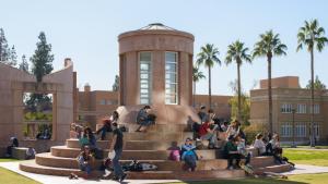 A group of students hang out on Hayden Lawn. 