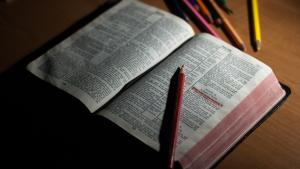 A bible opened with a psalm highlighted