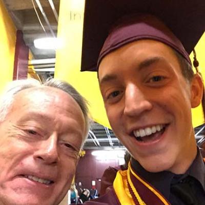 Alum  Brian Pavey with Advisor Michael Currey at graduation