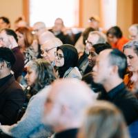 A crowd looks on during the Race Before Race conference. 